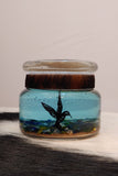 Small hummingbird gel candle with blue gel by Branding Stove candles