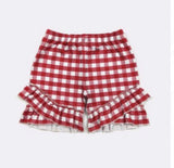 Red and white gingham check shorts with ruffled hems, shown flat against a light gray background.