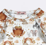 Children's shirt with Noah's Ark and animal pattern on a white background