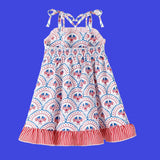 Children's dress with red, white, and blue pattern on a white background
