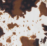 Close-up of a cowhide rug with brown and white pattern