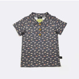Children's polo shirt with Tractor pattern on a white background
