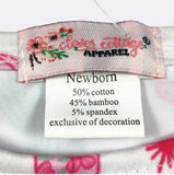 Fabric tag with 'Little Clove Cottage Apparel' branding and product details.