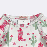 Baby onesie with pink cowboy boots and cactus pattern on a white background