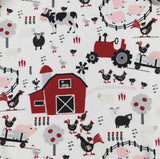 Farm-themed fabric with animals, barn, and tractor on a white background