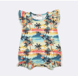 Tropical print dress with palm trees and sunset design on a white background