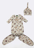 A baby sleep suit and matching hat set in a desert camouflage pattern, displayed flat on a light gray background.