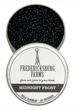 A small, round tin Fredericksburg Farms air freshener with a black solid color interior, labeled 'Midnight Frost'.