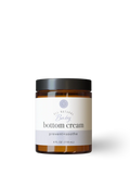 Jar of baby bottom cream on a white background