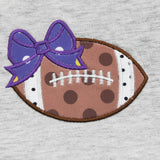 CLOVER COTTAGE - CLOSE UP FOOTBALL WITH PURPLE RIBBON -https://tammysoutfitters.com/collections/clover-cottage 