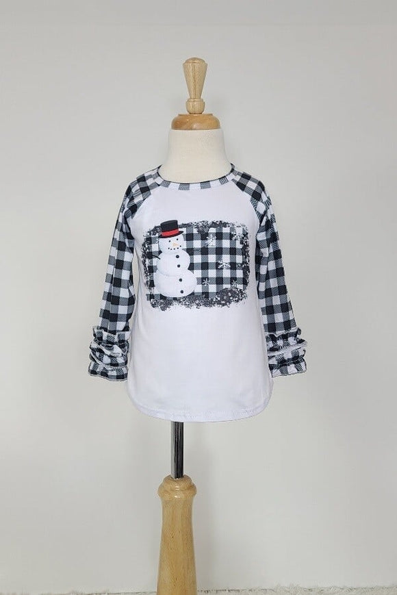 Child's raglan sleeve t-shirt with a snowman on black and white gingham.