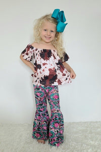 Cowhide top and Aztec print pants. This is a set designed by Clover Cottage chicldren's clothes.