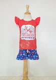 Screen-printed lil Miss Firecracker on red paint-splattered cap sleeved shirt with blue star shorts