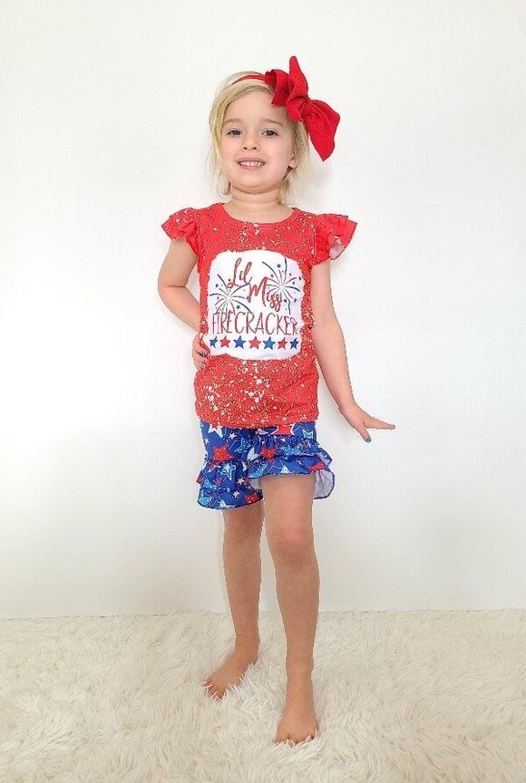 Screen-printed lil Miss Firecracker on red paint-splattered cap sleeved shirt with blue star shorts - set