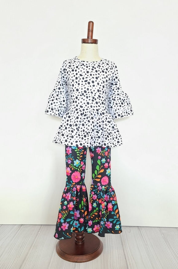 floral flare pants and a dalmatian print top with flare waist and sleeves. child's set