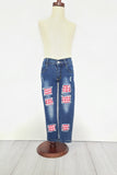 Denim pants with trendy holes patched with red gingham