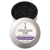 A small, round tin Fredericksburg Farms air freshener with a purple solid color interior, labeled 'Bird of Paradise'.
