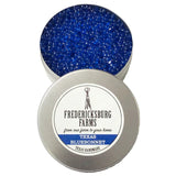 A small, round tin Fredericksburg Farms air freshener with a Blue solid color interior, labeled 'Texas Bluebonnet'.