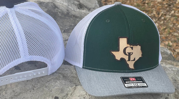 Canyon Lake high school hat. Features a grey bill, green crown and white mesh.