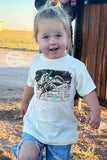 Wyatt Tee Sterling Kreek t-shirt. Little girl in denim wood outdoor background.