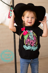 Onsie for toddler with neon rodeo sign outta hand being worn by a little boy with a cowboy hat