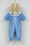 blue gingham baby romper by Clover Cottage on a mannequinn