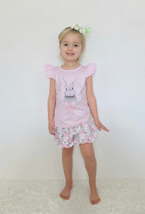 Pink ruffled shirt with a grey bunny on the chest. Pink and white floral print shorts in this set