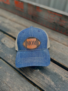 Denim brim and crown baseball hat with a leather football patch with MOM on it