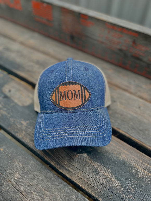 Denim brim and crown baseball hat with a leather football patch with MOM on it