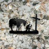 The metal cutout inside the Branding Ctove praying cowboy candle